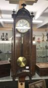 A Victorian mahogany Vienna single weight wall clock with barley twist decoration.