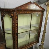 A Victorian marquetry hanging cabinet.