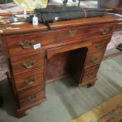 A Victorian mahogany kneehole desk.