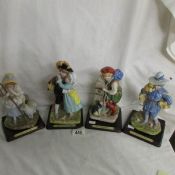 4 Madame Tussauds figurines being Little Bo Peep, Babes in the Woods,