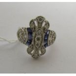 An 18 carat white gold 62 point diamond and square cut sapphire ring, size L.