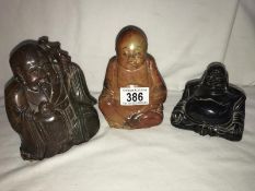 3 Carved stone Buddha figures.