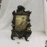 A 1920s cold painted spelter photograph frame.