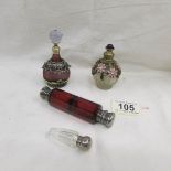 A double ended ruby glass scent bottle with plated fittings,