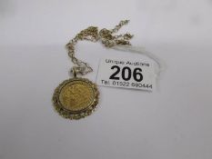 A 1919 half sovereign as a pendant in a 9ct gold mount with attached 9ct gold chain.