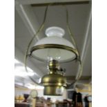 A brass ceiling oil lamp.