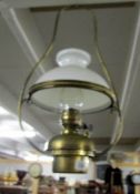 A brass ceiling oil lamp.