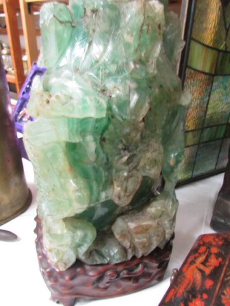 A tall heavy piece of carved jade on original stand, a/f. - Image 4 of 4