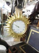 A sunburst clock by Karlsson.