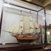 A superb model of 'The Bounty' in a display case, 100 x 100 x 31 cm..
