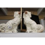 A pair of 19th century Staffordshire spaniel dog figures.