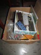 A box of model railway rolling stock, track etc.