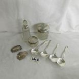 4 silver teaspoons, 2 silver wine labels and 3 glass items with silver tops.