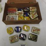 A collection of gramophone needle tins with contents including sealed tins,