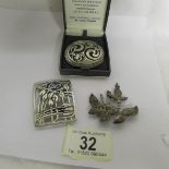 A Cornish Celtic brooch in pewter and 2 other brooches.