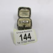 A diamond old cut three stone ring set in 18ct gold, estimated total weight .65 ct. Size L Half.