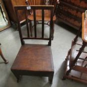 A Rocking nursing chair with a side drawer.