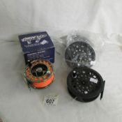 A New Airflo T7 fly reel and a new Contender reel with 2 spare spools.