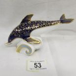 A Royal Crown Derby dolphin paperweight with gold stopper.