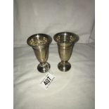 A pair of small hallmarked silver posy vases.
