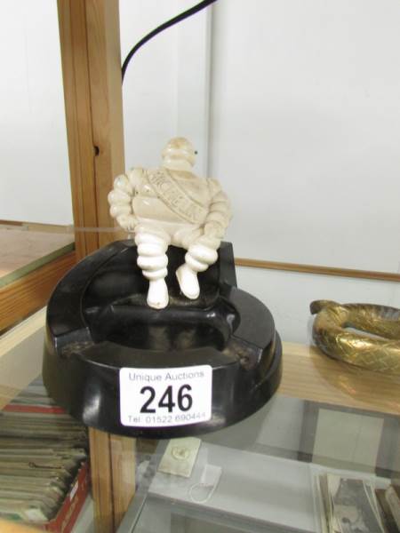 A vintage bakelite Michelin man ashtray, base a/f.