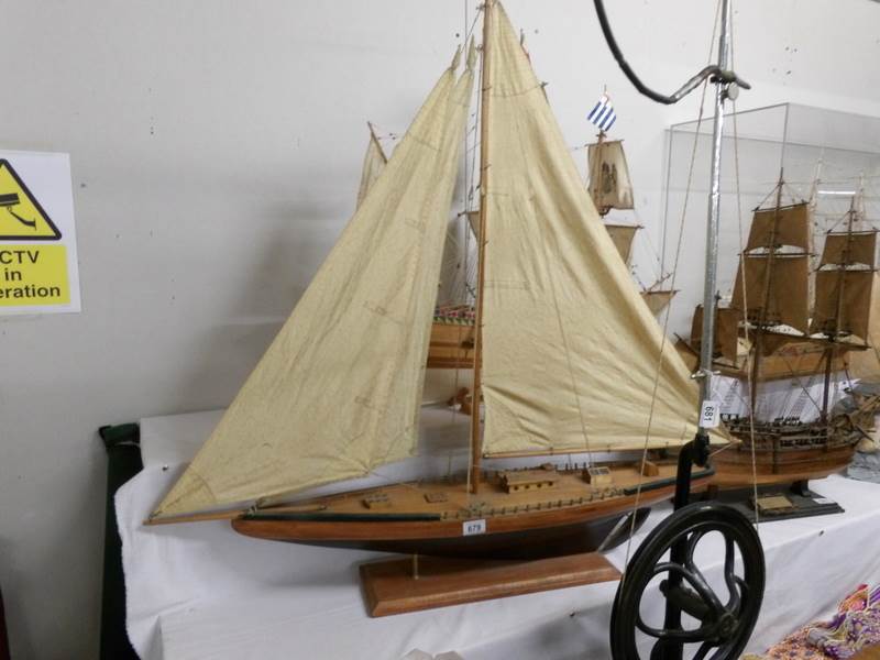 A model sailing yacht.