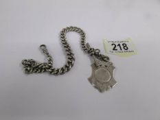 A silver Albert chain with fob, Birmingham 1893, 63 grams.