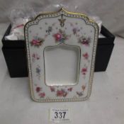 A boxed Royal Crown Derby photograph frame with certificate.