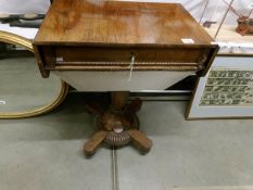 A Victorian rosewood sewing table.