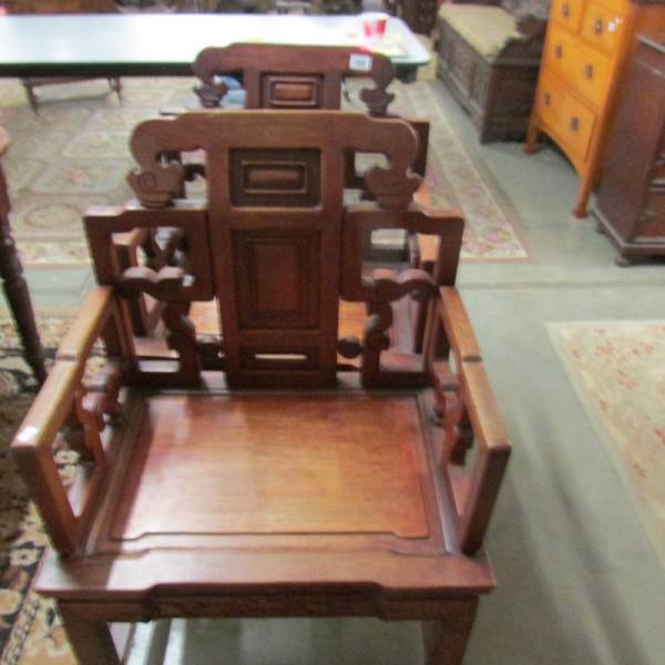 A pair of Chinese arm chairs.