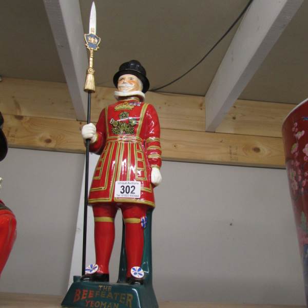 A Beefeater gin ice bucket and 2 Beefeater figures. - Image 2 of 4