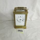 A brass carriage clock complete with key.