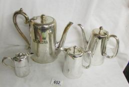 A coffee pot and a small pot both marked SS Flora and 2 other pots.