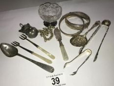 A mixed lot of silver items including 2 bangles, 2 sugar nips, 2 pickle forks, a spoon,