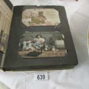 A post card album of in excess of 100 vintage postcards including birthday, Christmas, Dorchester,