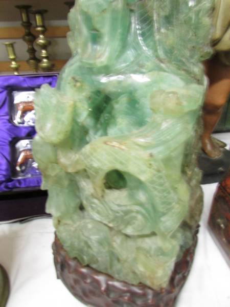 A tall heavy piece of carved jade on original stand, a/f. - Image 3 of 4