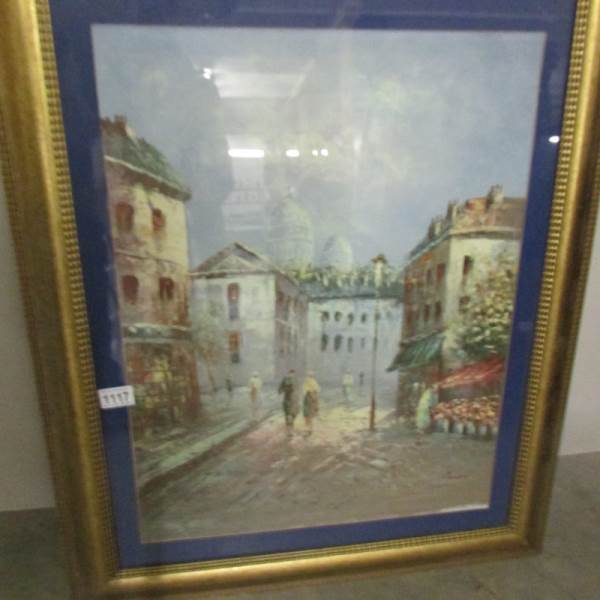 A framed and glazed oil painting of a continental village scene signed by the French artist