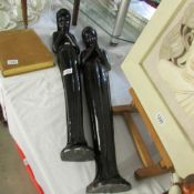 2 African praying female figures, 90 cm and 84 cm tall. (Possibly ebony).