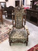 A carved and upholstered throne chair ****Condition report**** We cannot post this