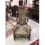 A carved and upholstered throne chair ****Condition report**** We cannot post this