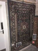 A large patterned rug size 7'9" x 5'3"