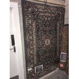 A large patterned rug size 7'9" x 5'3"
