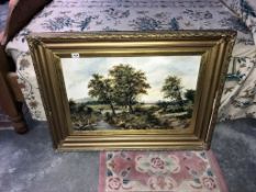 An oil on canvas landscape in gilt frame signed H.