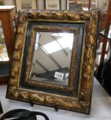 A superb mirror in a gilded frame, 44 x 40 cm.