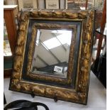 A superb mirror in a gilded frame, 44 x 40 cm.