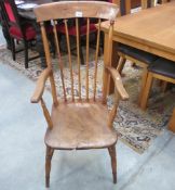 A 19th century oak stick back carver chair