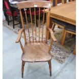 A 19th century oak stick back carver chair