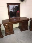 A mirror backed dressing table