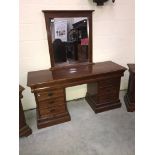 A mirror backed dressing table