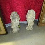 A pair of garden lion statues.